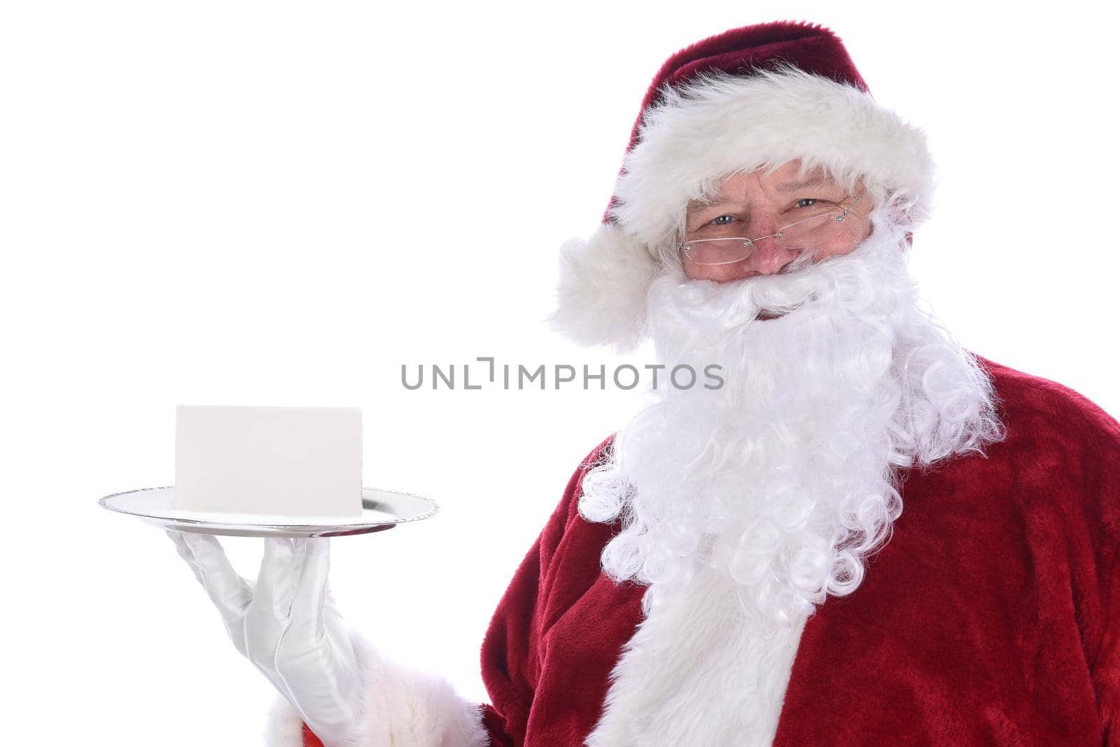 Santa Claus holding a silver platter with a blank note card, isolated on white.