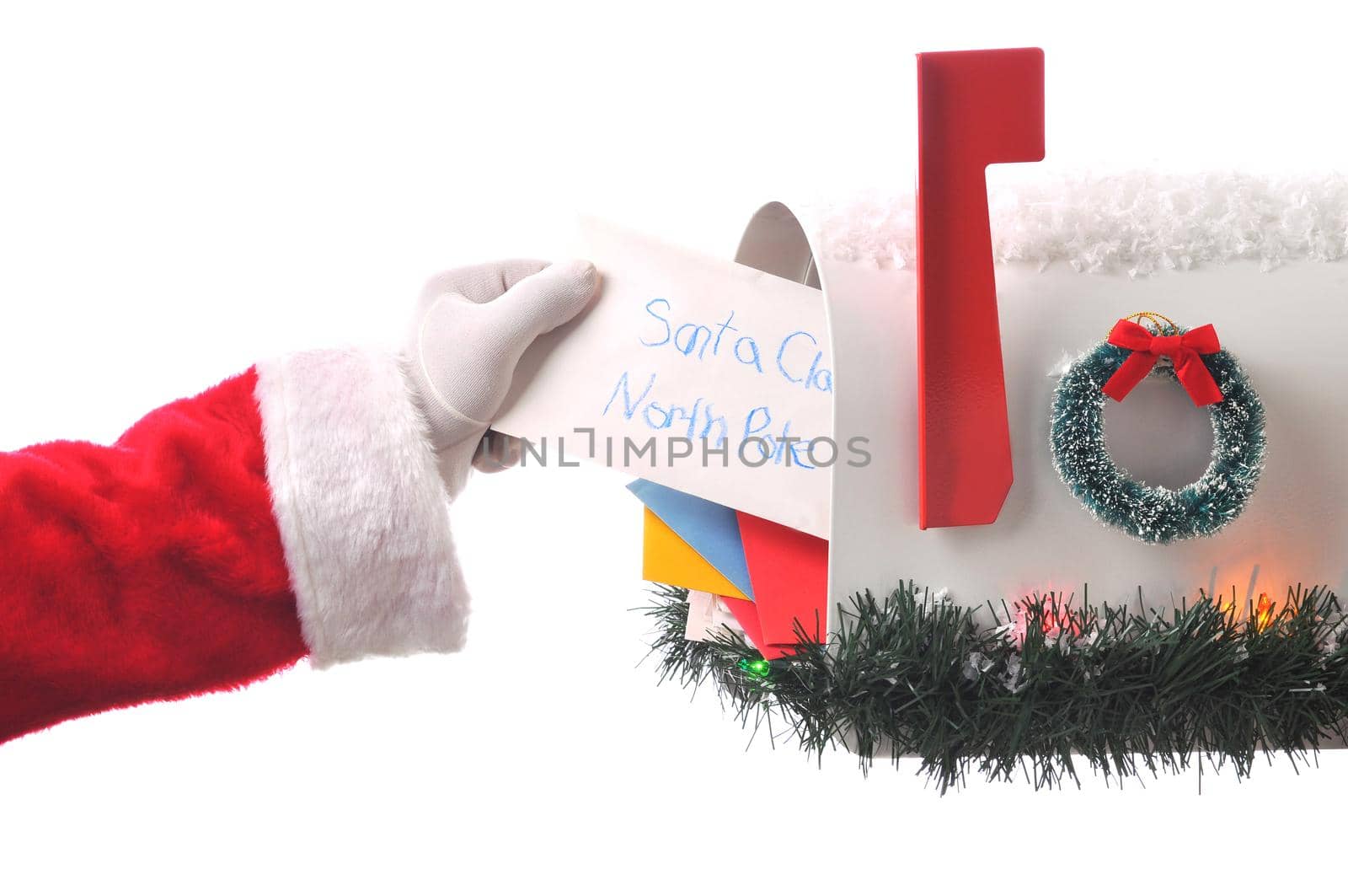 Santa Claus Taking Letter from Mailbox Full of Mail. Horizontal composition, isolated on white hand and arm only.