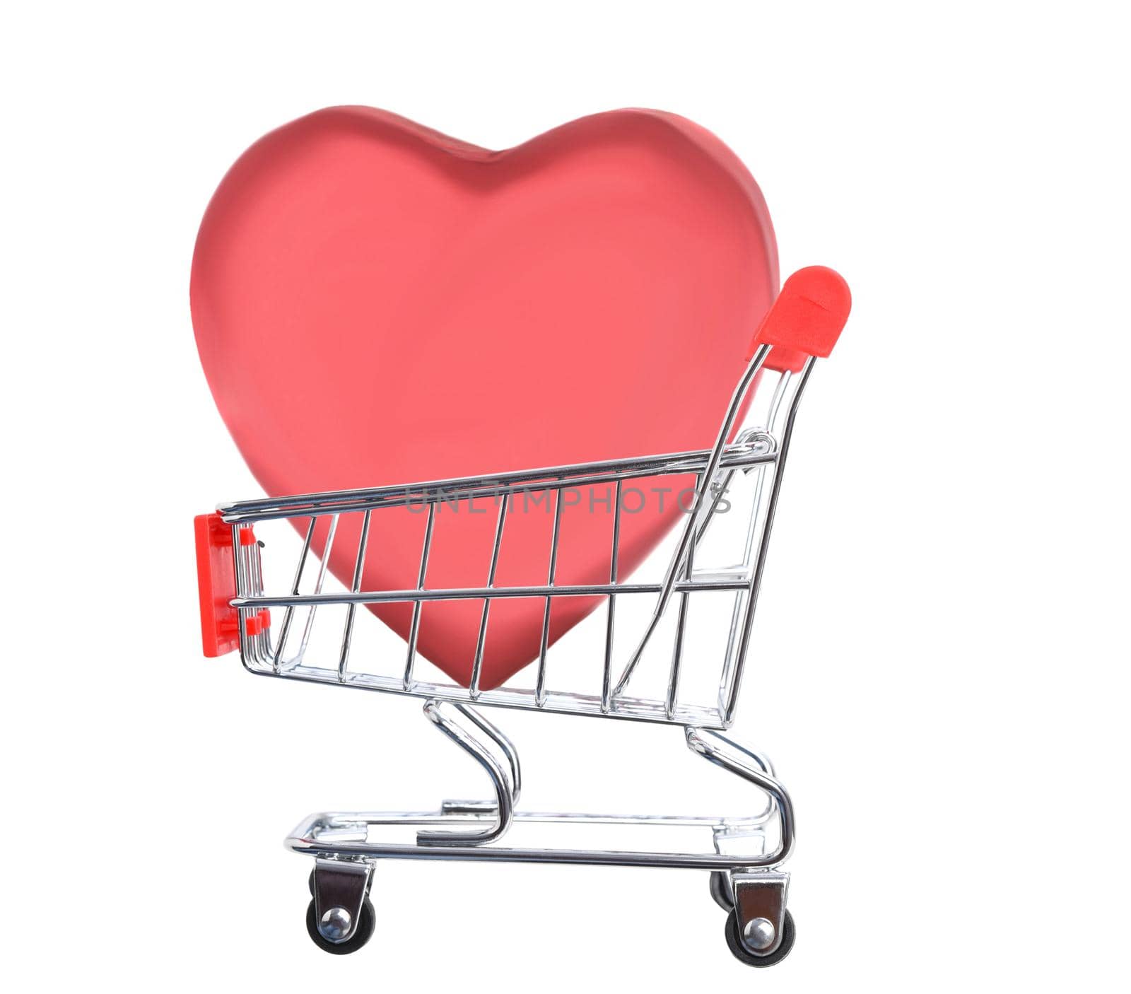 Valentines Day Concept. A large heart shaped candy box inside a grocery shopping cart, isolated on white.  by sCukrov