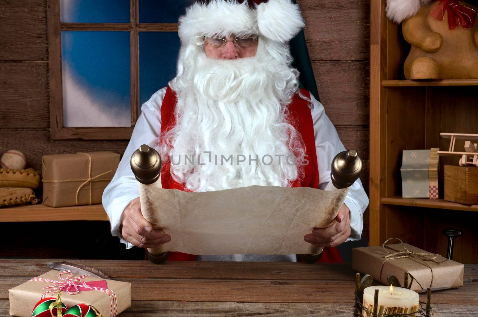 Santa Claus Sitting in His Workshop Reading a scrool with his Naghty and Nice List by sCukrov