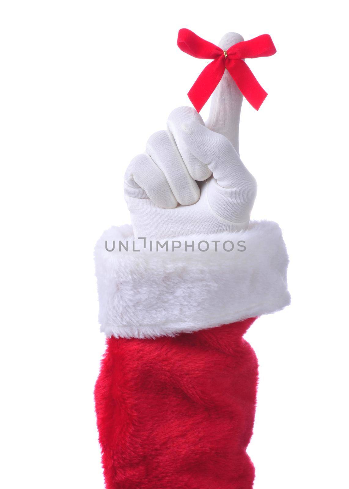 Closeup of  Santa Claus hand pointing upwards with red ribbon tied around index finger isolated on white. Remember Christmas concept.