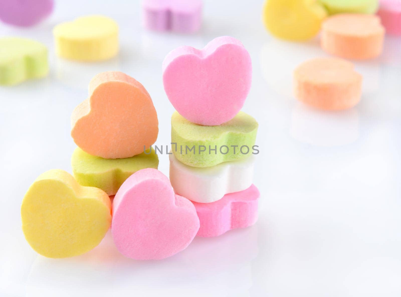 Candy Hearts on White With Reflection by sCukrov