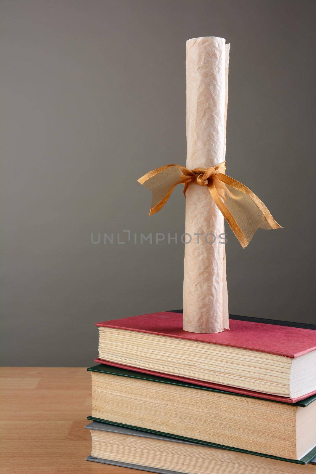 Diploma on Stack of Books by sCukrov