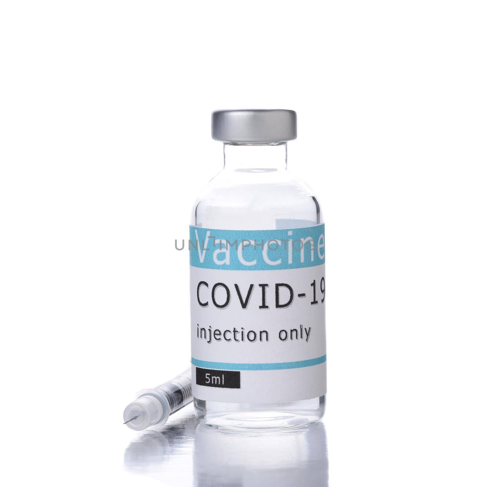 A Covid-19 Vaccine vial and syringe on white.