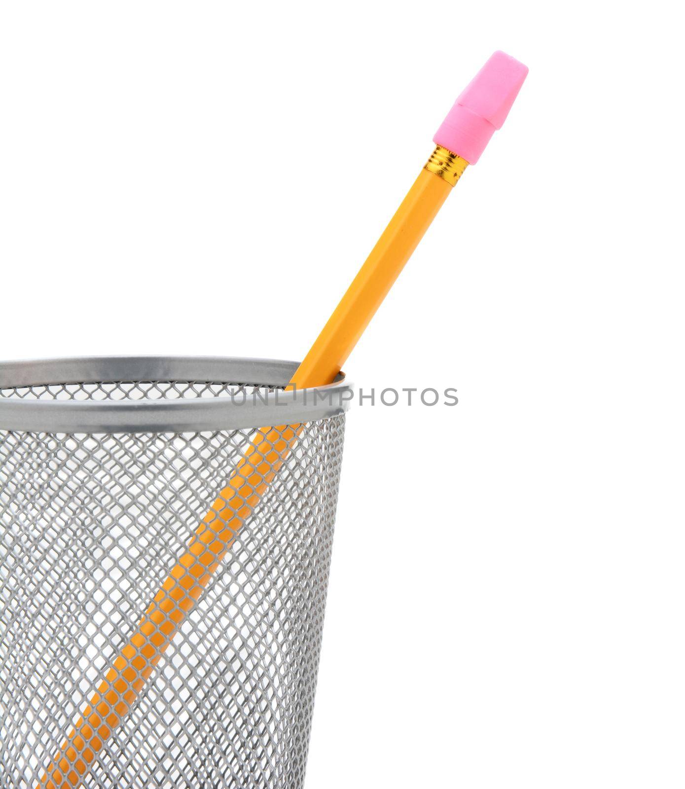 Closeup of a single pencil in a wire pencil cup isolated on white. The yellow pencil has a stick on pink eraser and is at an angle. 