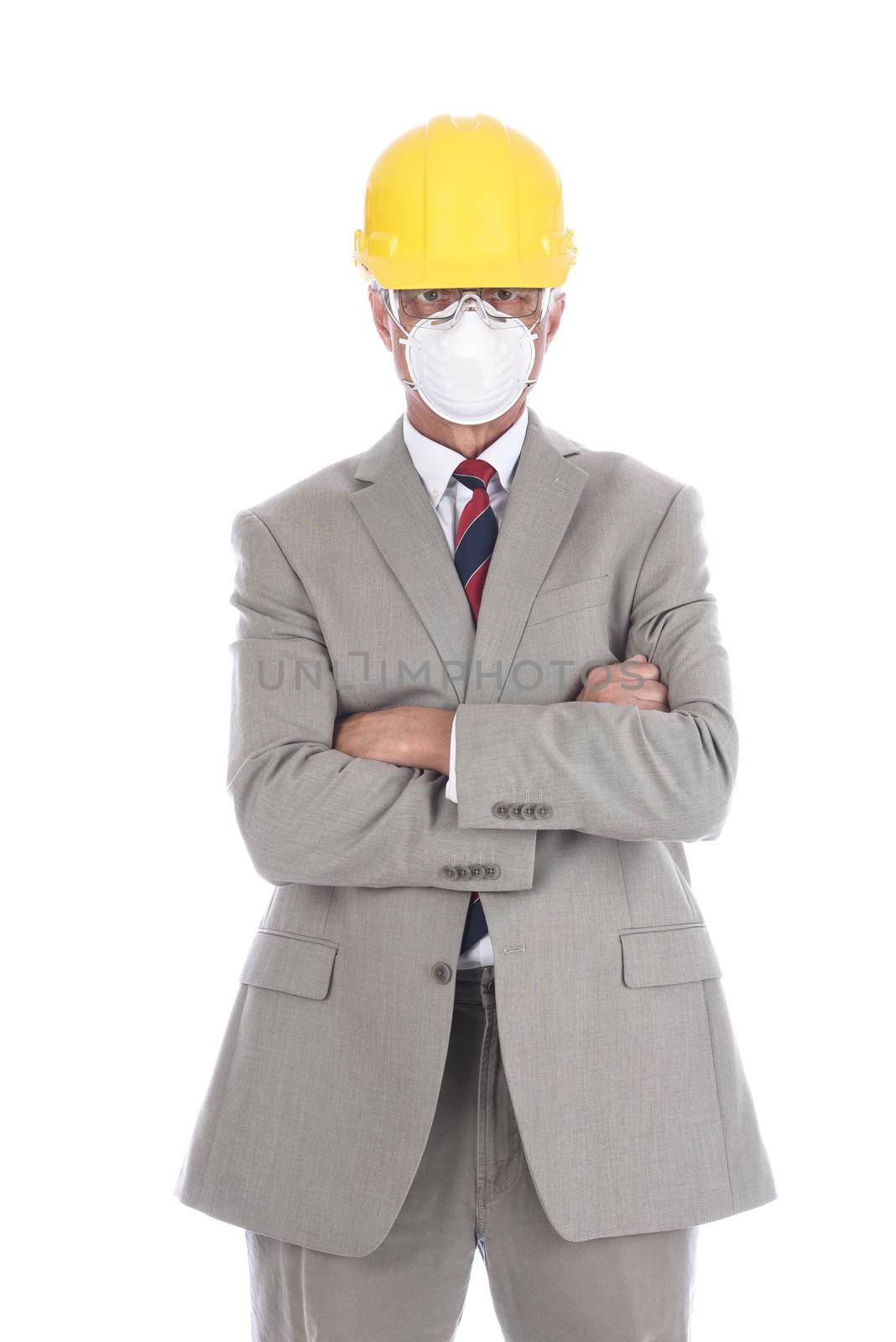 A businessman architect in a light tan suit wearing a hard had and protective face mask.  by sCukrov