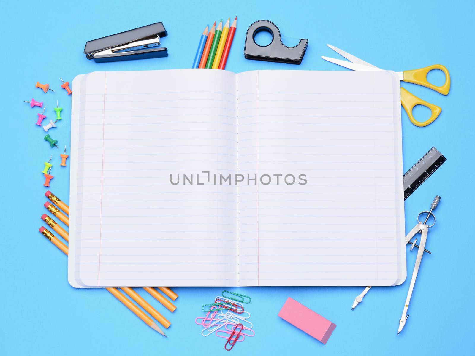 Open Notebook With School Supplies by sCukrov
