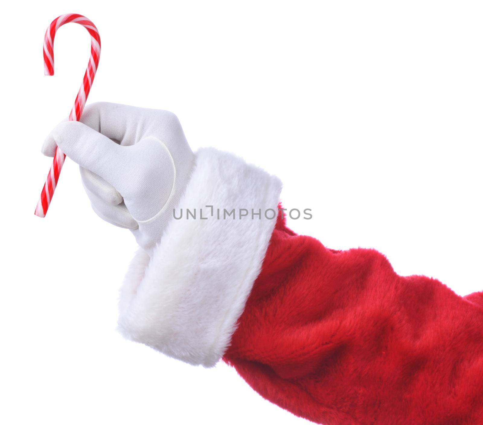 Closeup of Santa Claus holding a candy cane in his fingers isolated on white. Hand and sleeve only.