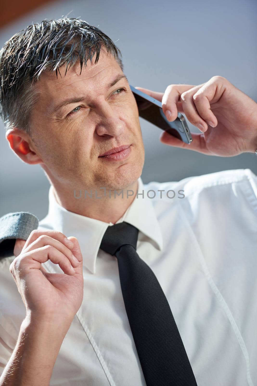 business man using phone at modern office space