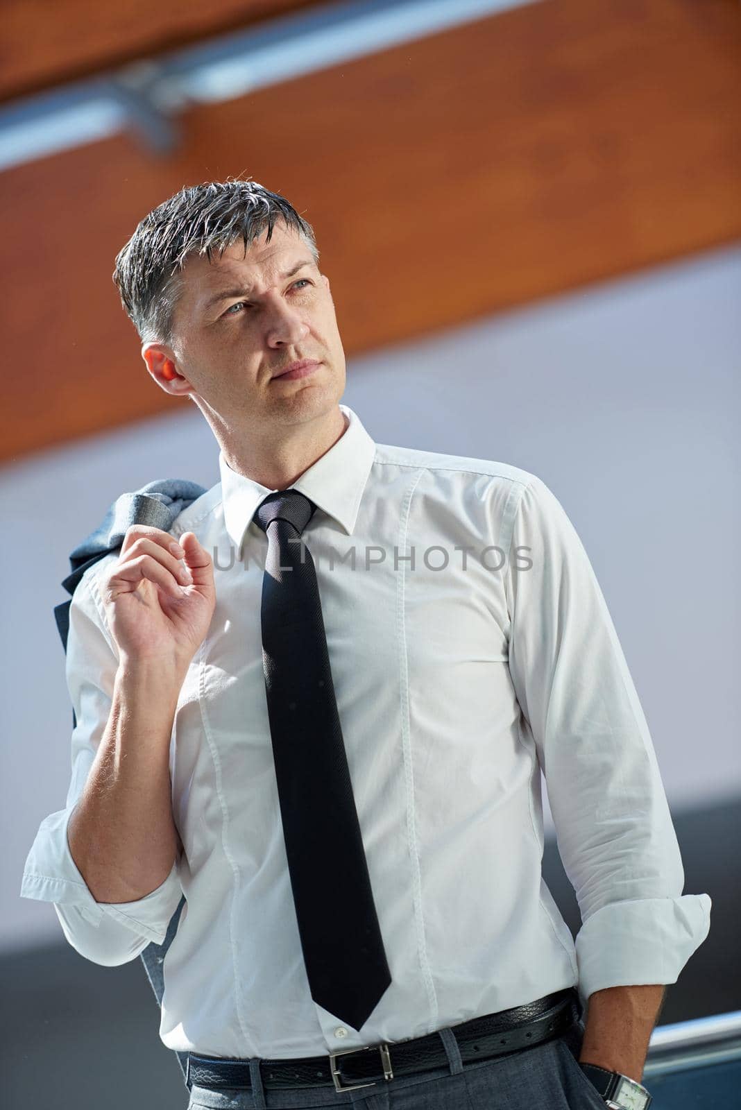 business man using phone at modern office space