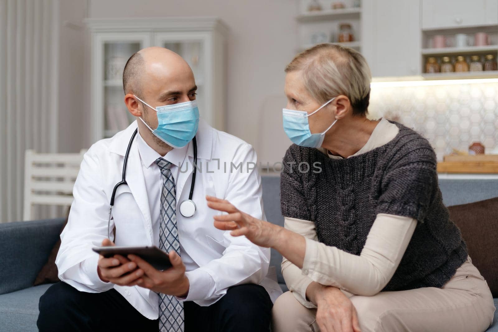 doctor with a digital tablet consulting his patient. concept of health protection.