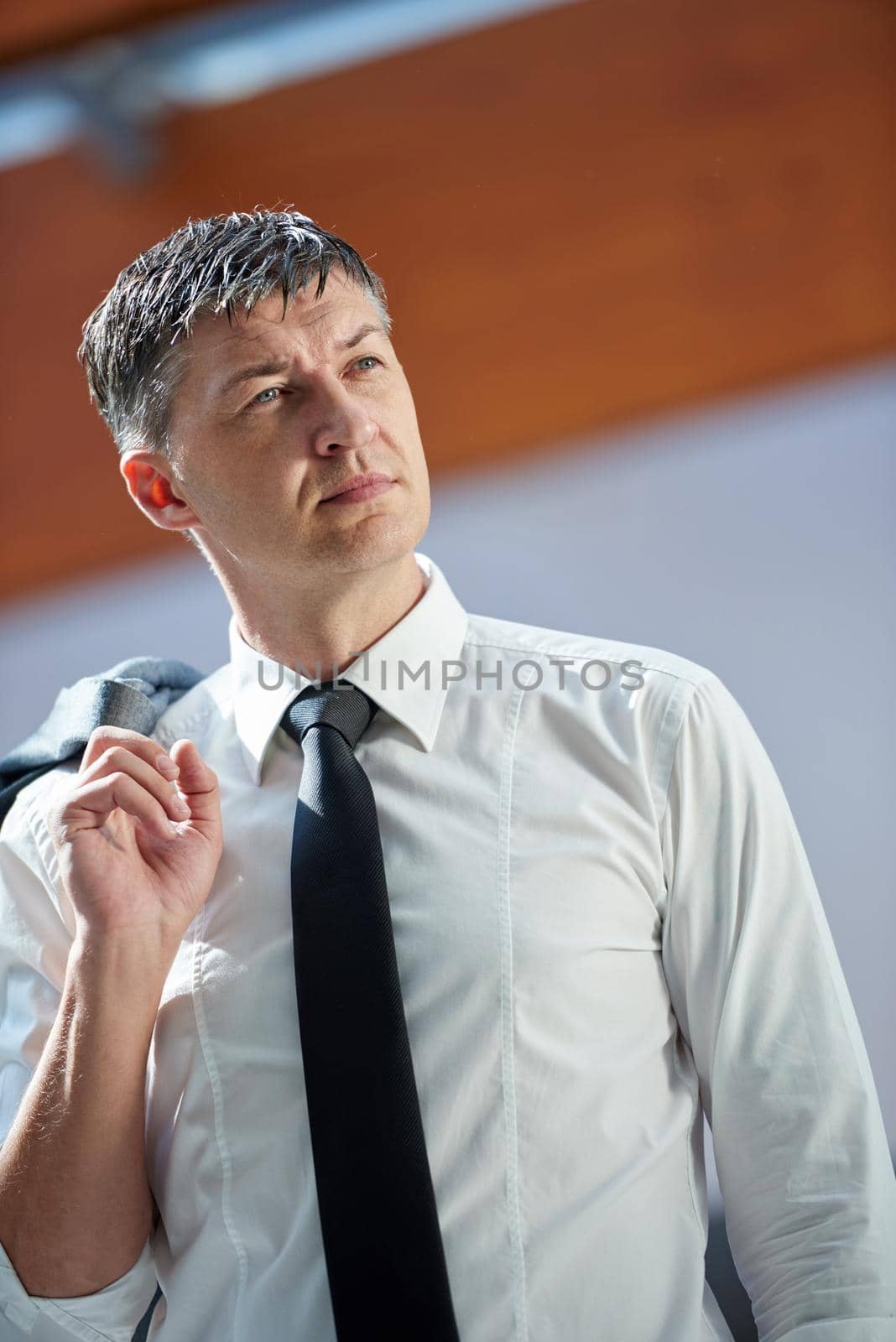 business man using phone at modern office space