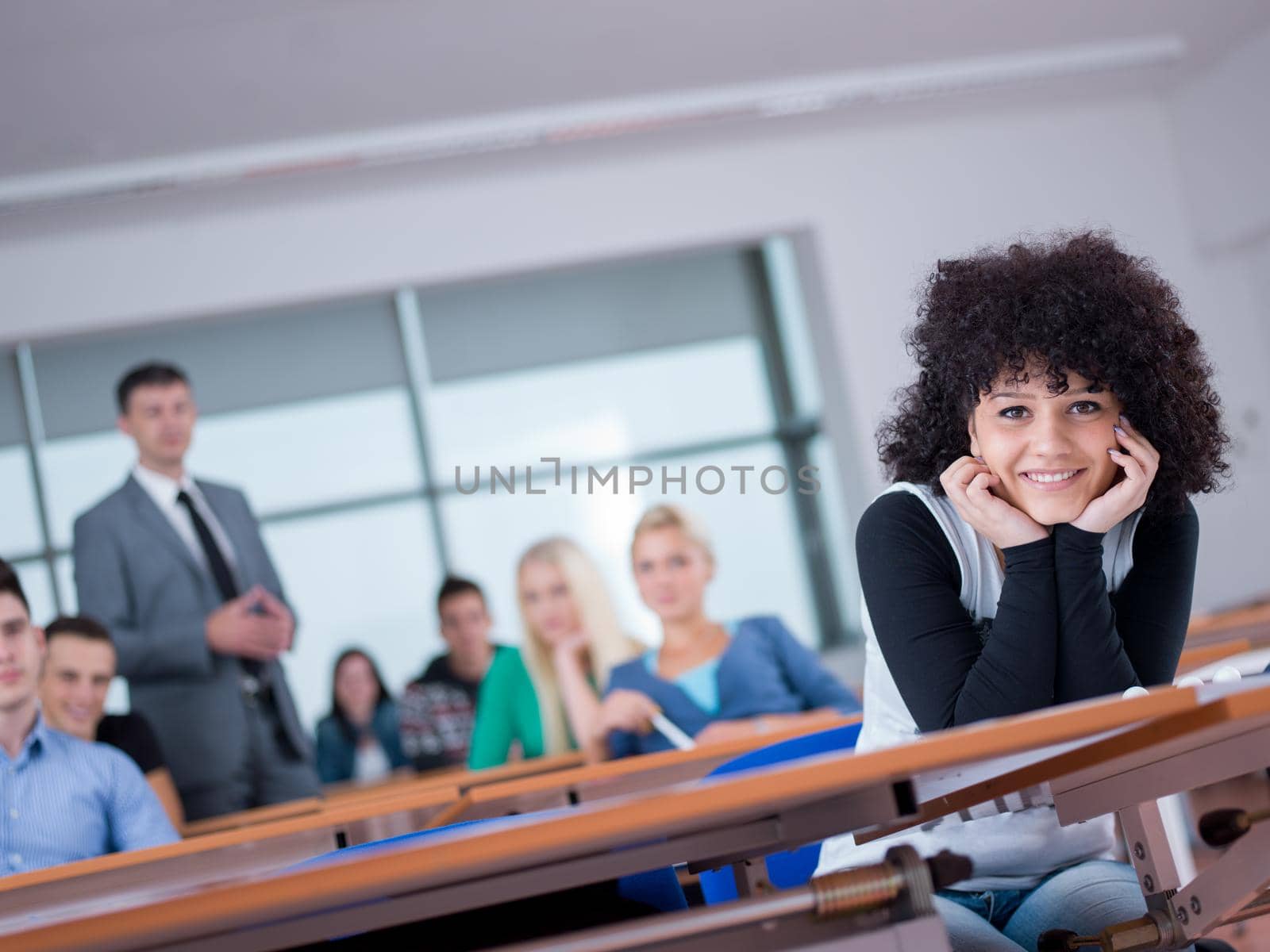 students with teacher  in computer lab classrom by dotshock