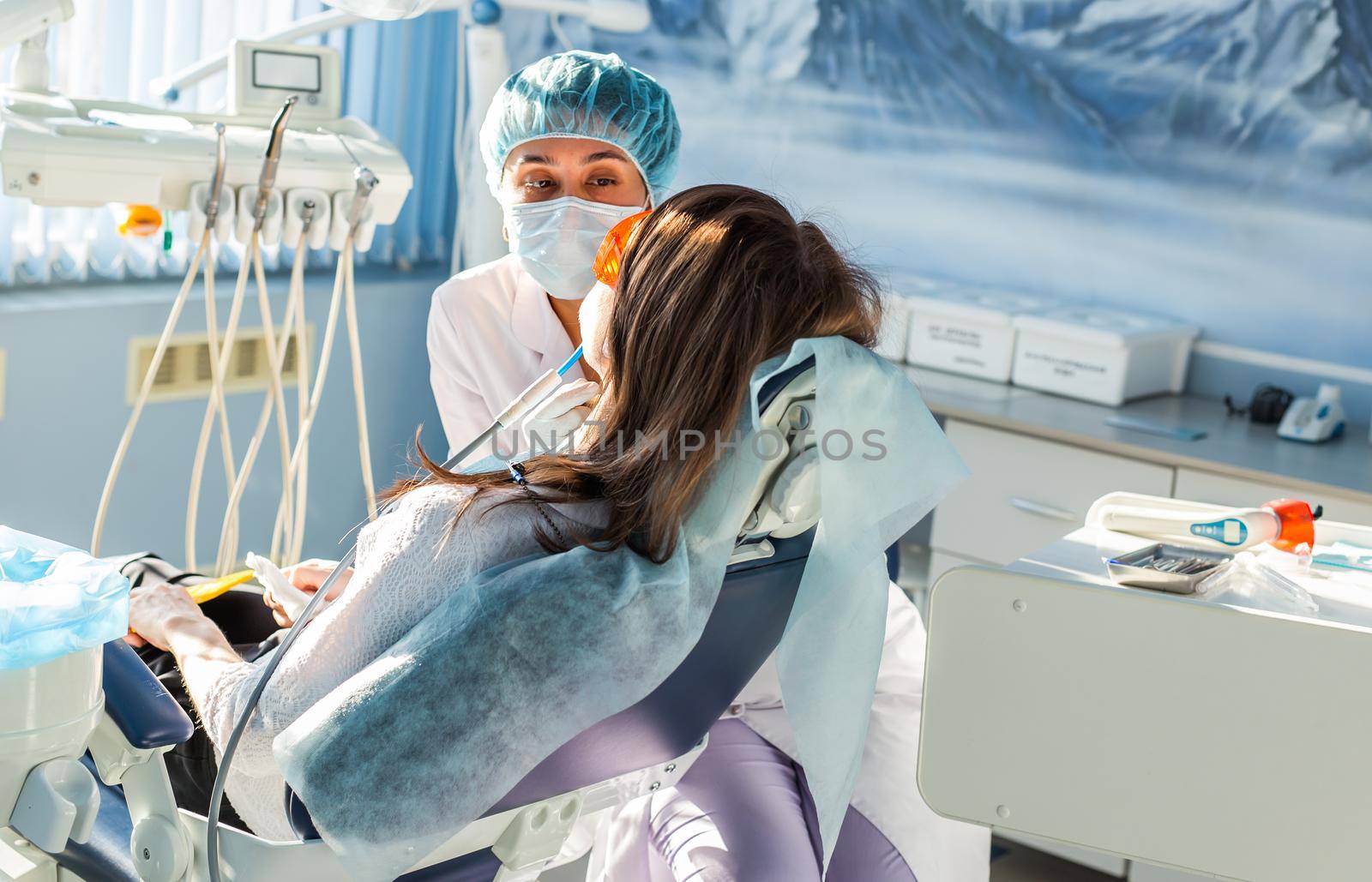 Young woman getting dental treatment. dental clinic