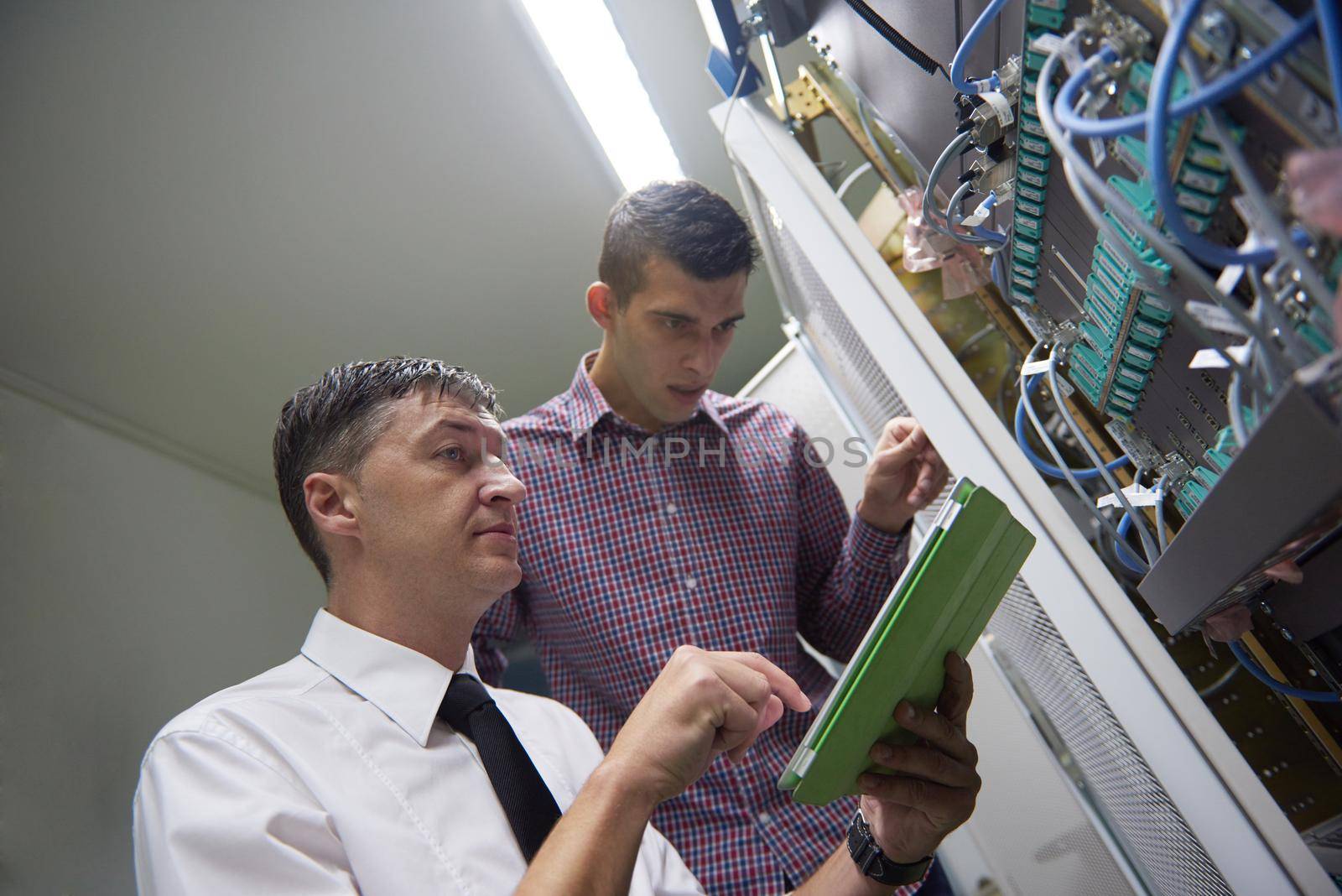 business people group working on tablet computer, network engineers in server room