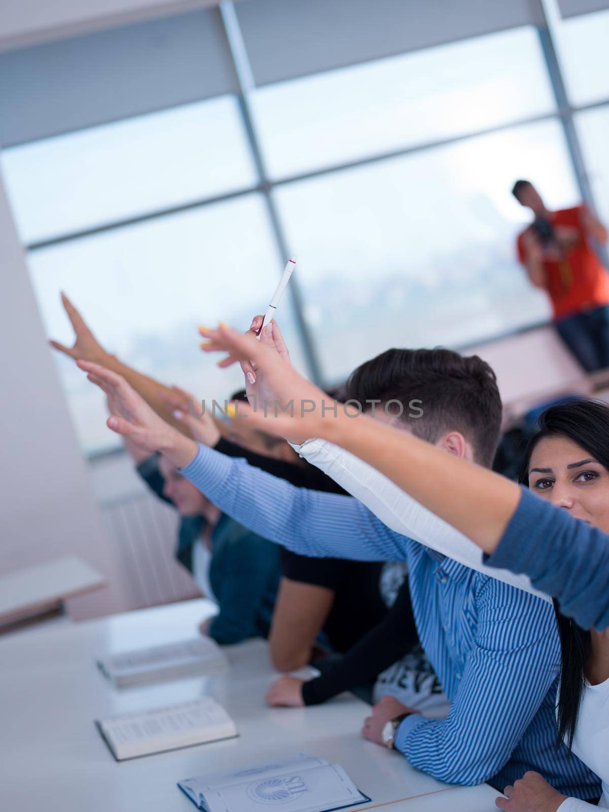 students group raise hands up by dotshock