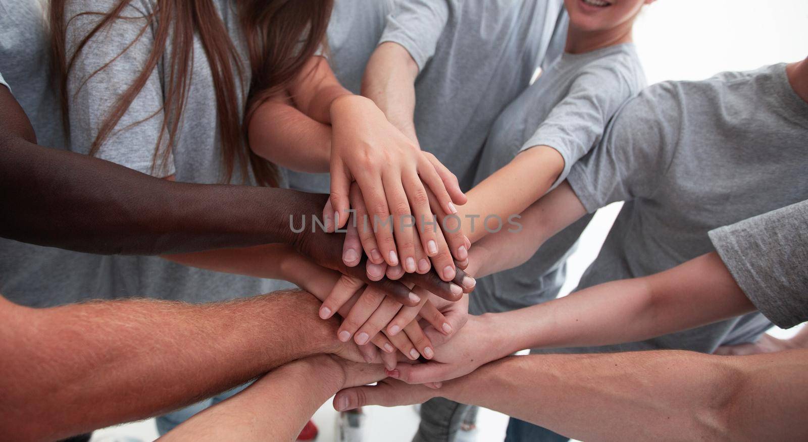 close up. a group of young people showing their unity . the concept of teamwork