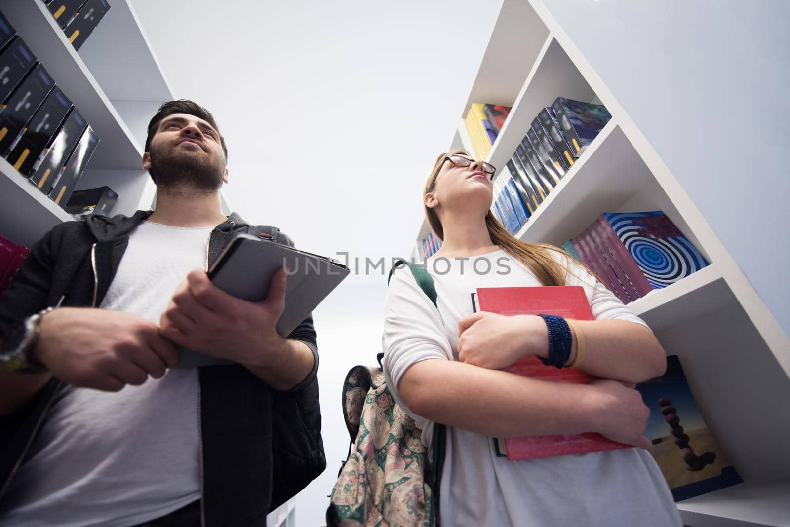 students group  in school  library by dotshock