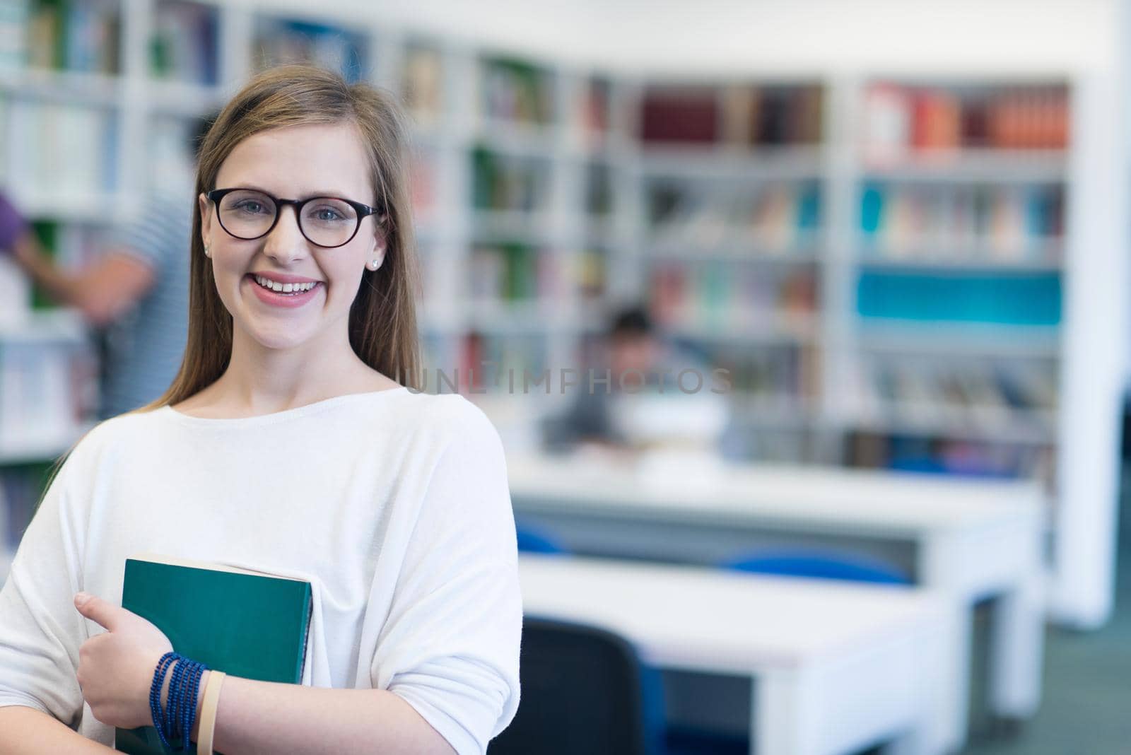 portrait of female student in library by dotshock