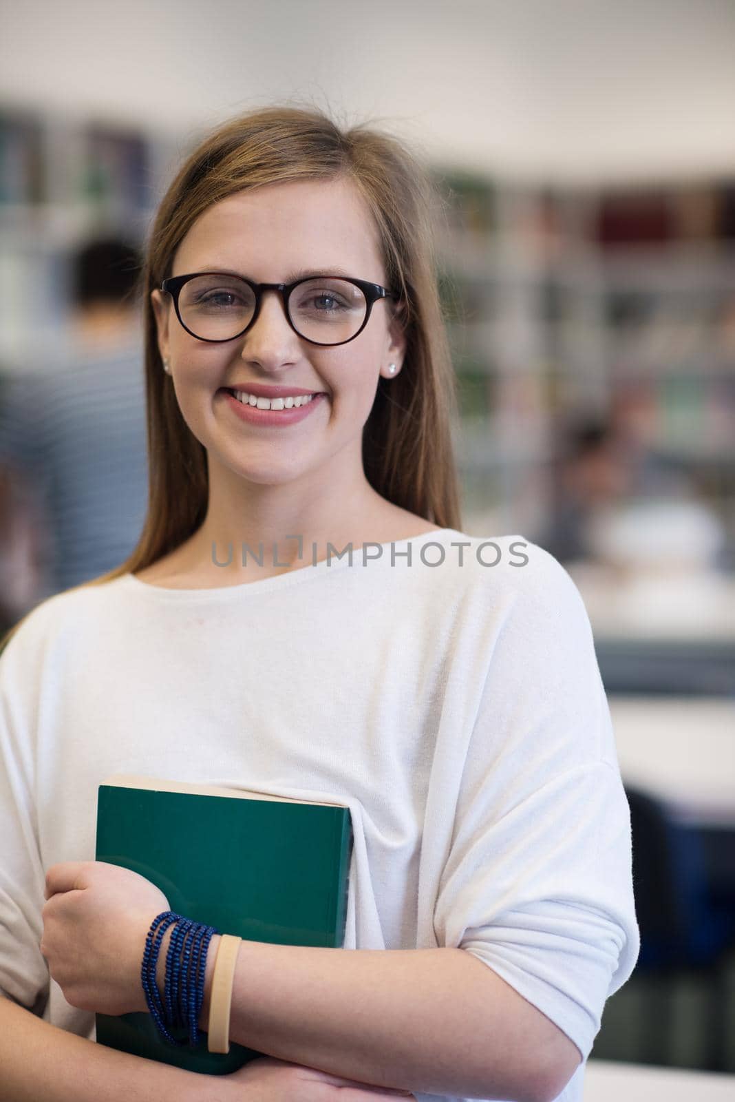 portrait of female student in library by dotshock