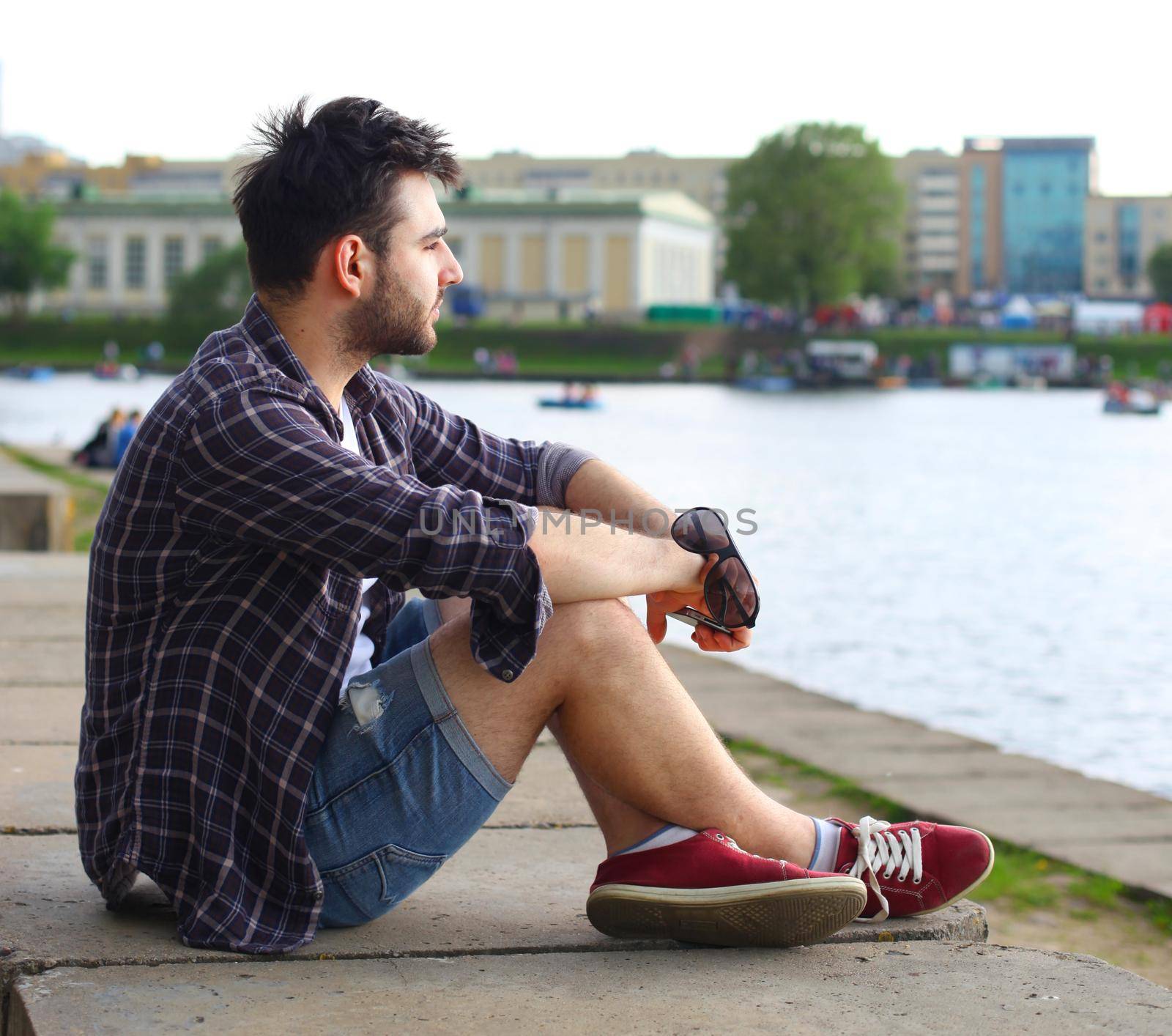 portrait of a trendy young man in the city