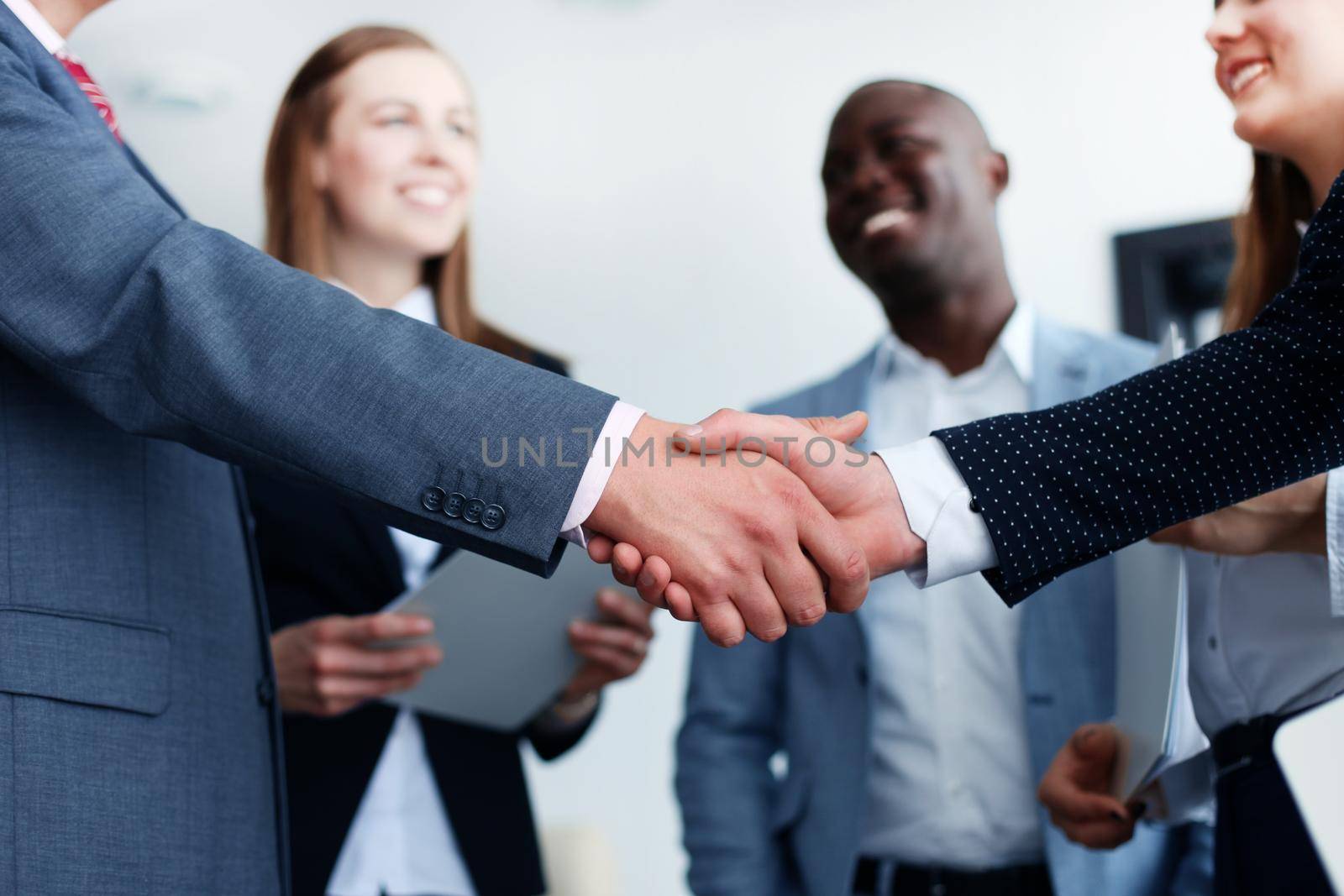 Business people shaking hands, finishing up a meeting