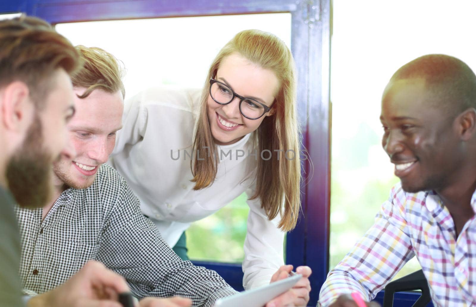 Image of business partners discussing documents and ideas at meeting