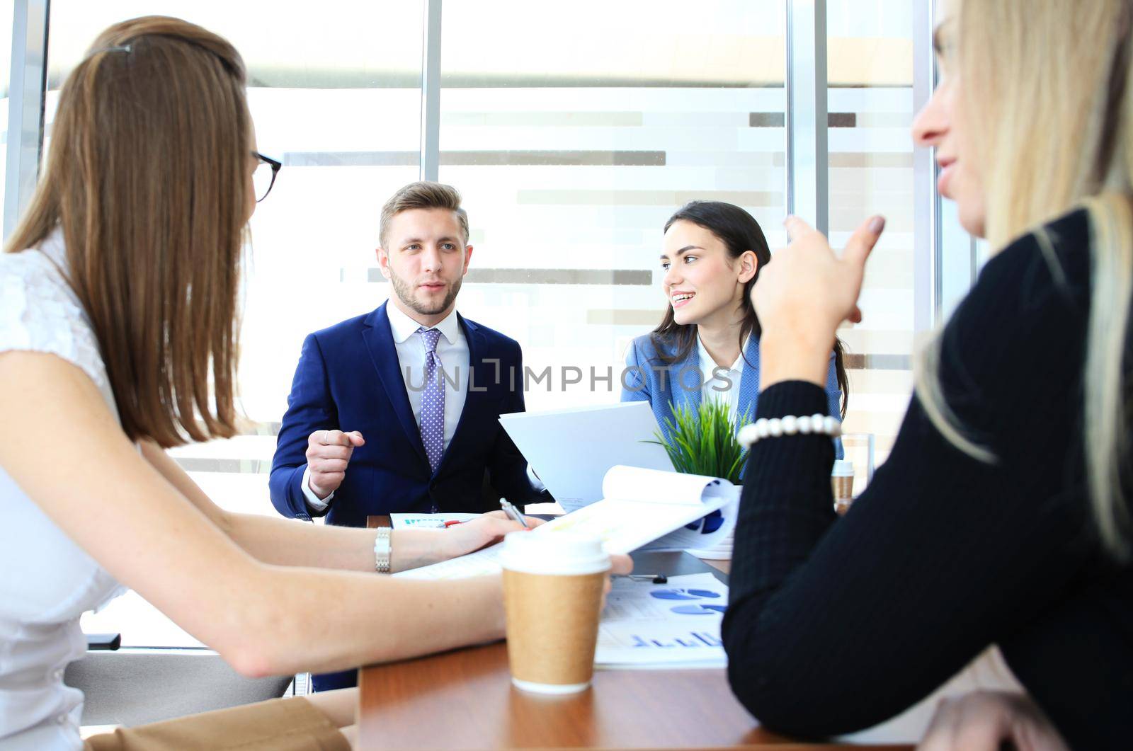 Business people working on new project at modern office by tsyhun