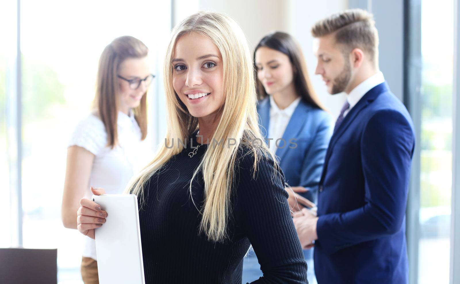 Face of beautiful woman on the background of business people