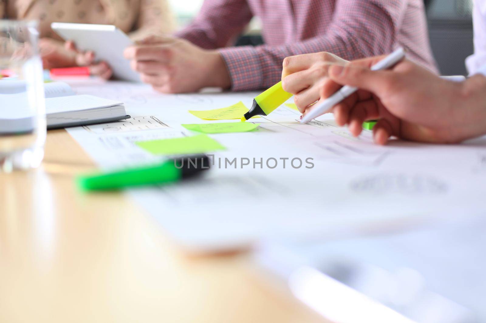 Image of business people hands working with papers at meeting by tsyhun