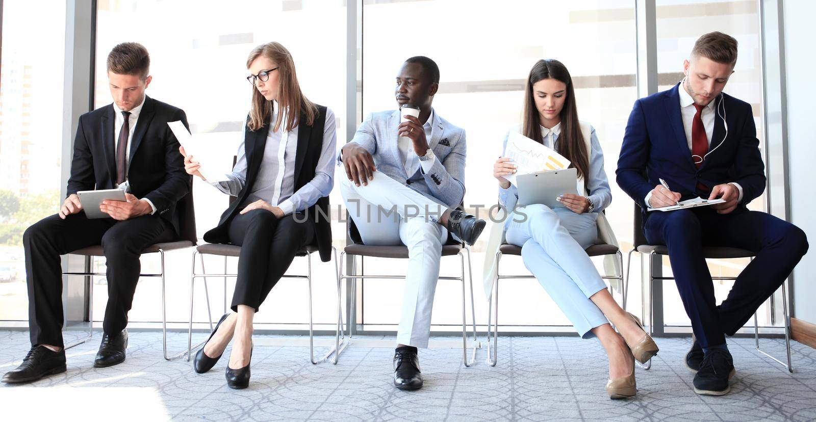 Business people waiting for job interview by tsyhun