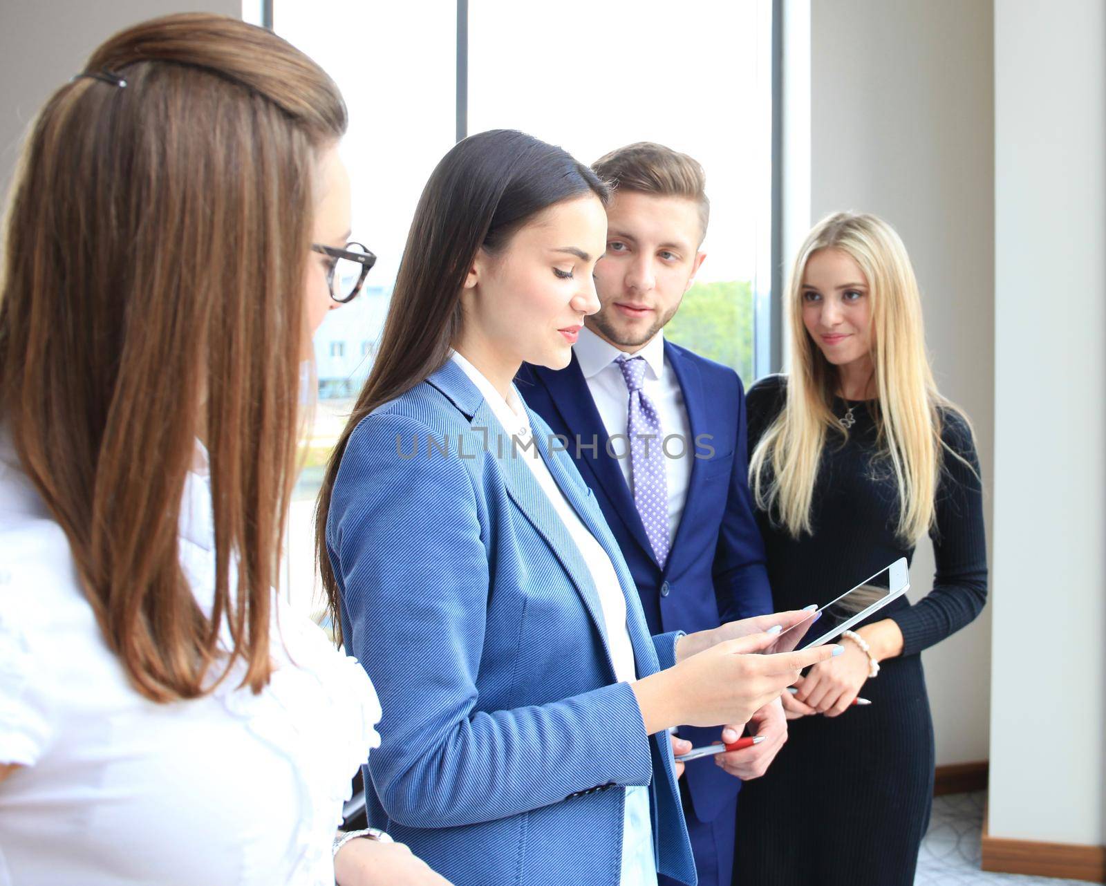 Group of buisness people working on tablet