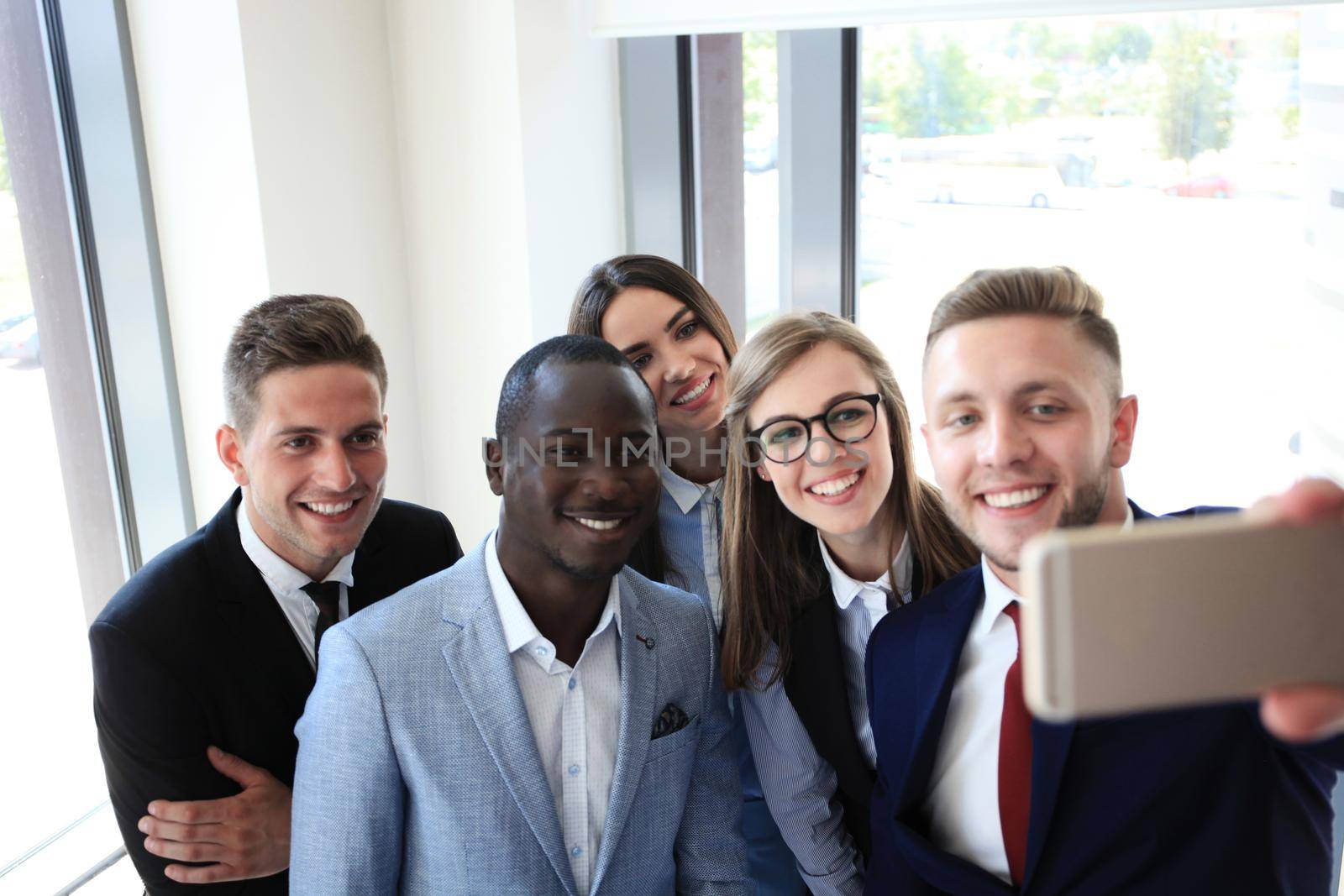 People taking selfie at business meeting
