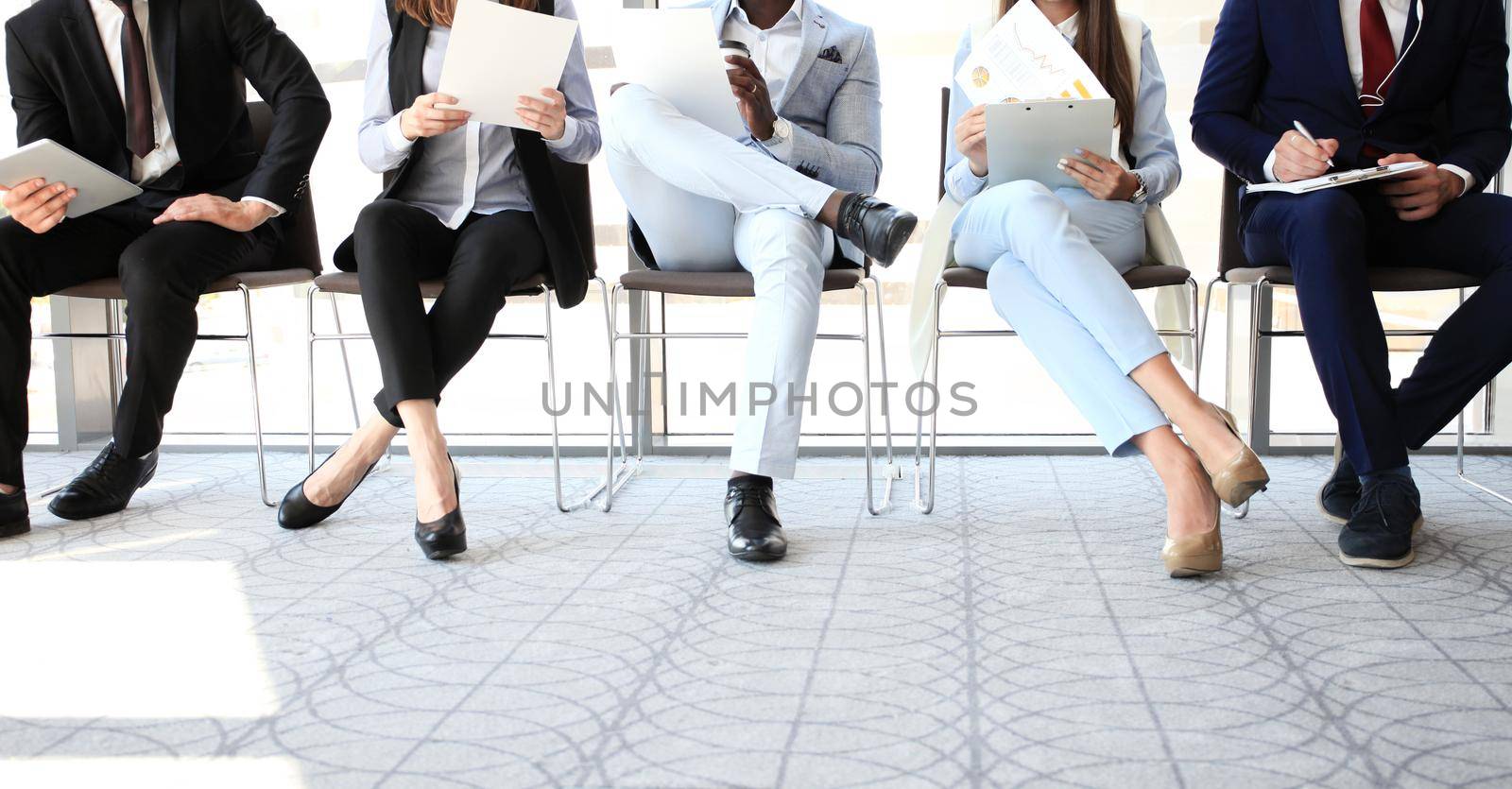 Stressful people waiting for job interview by tsyhun