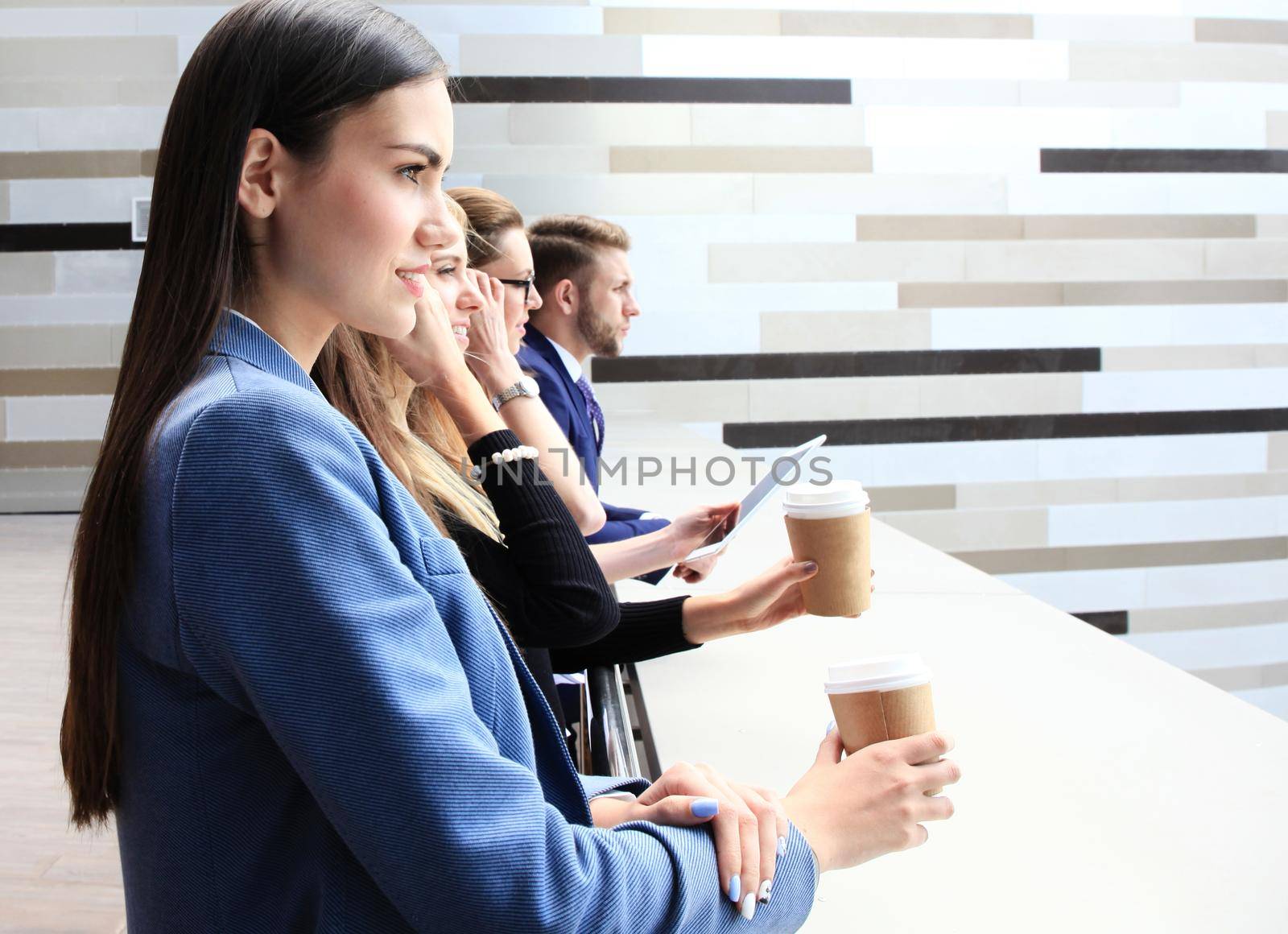 business team standing in a row outside the office