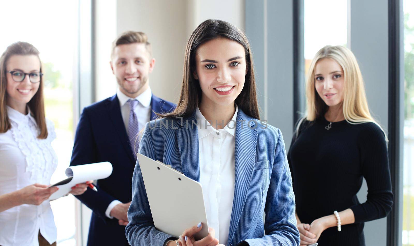 Face of beautiful woman on the background of business people