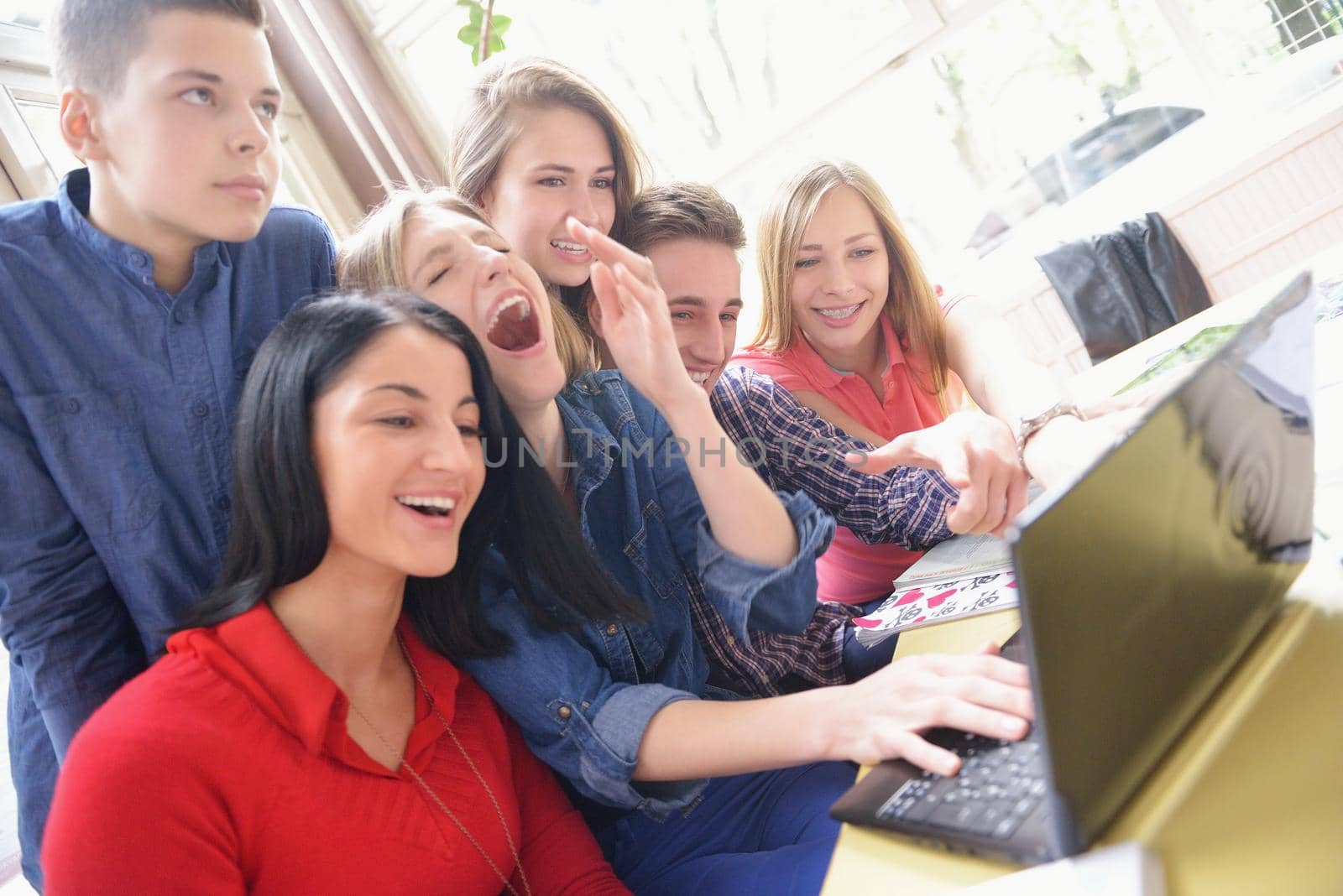 happy teens group in school by dotshock