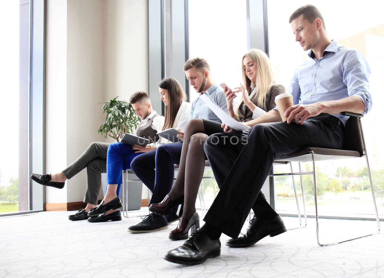 Business people waiting for job interview by tsyhun
