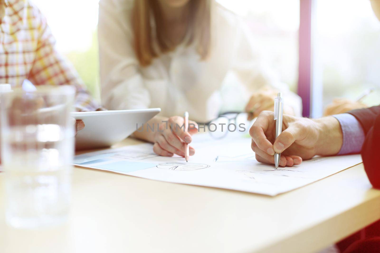 Image of business people hands working with papers at meeting by tsyhun