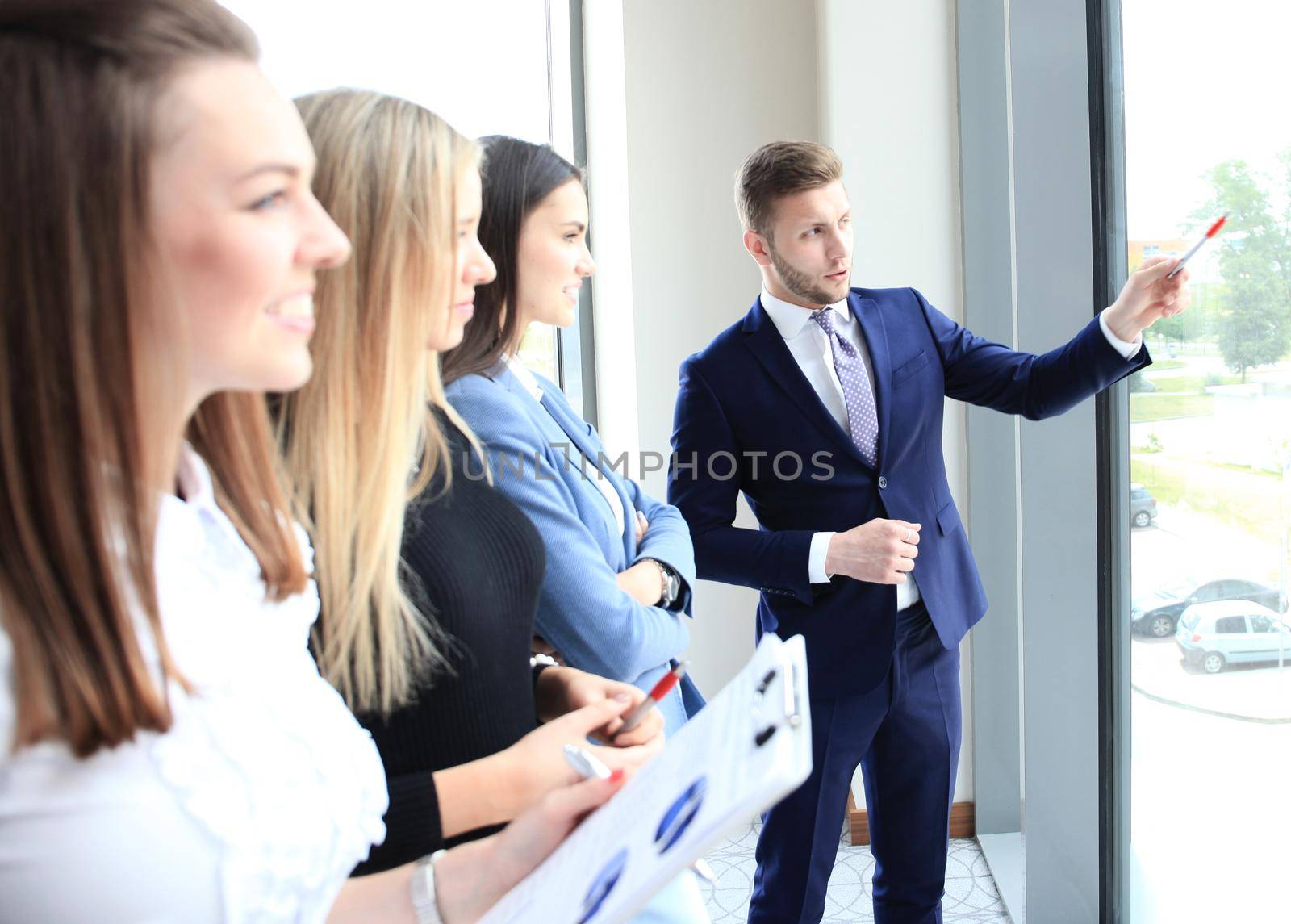 Business seminar where a boss explaining the company strategy to his colleagues