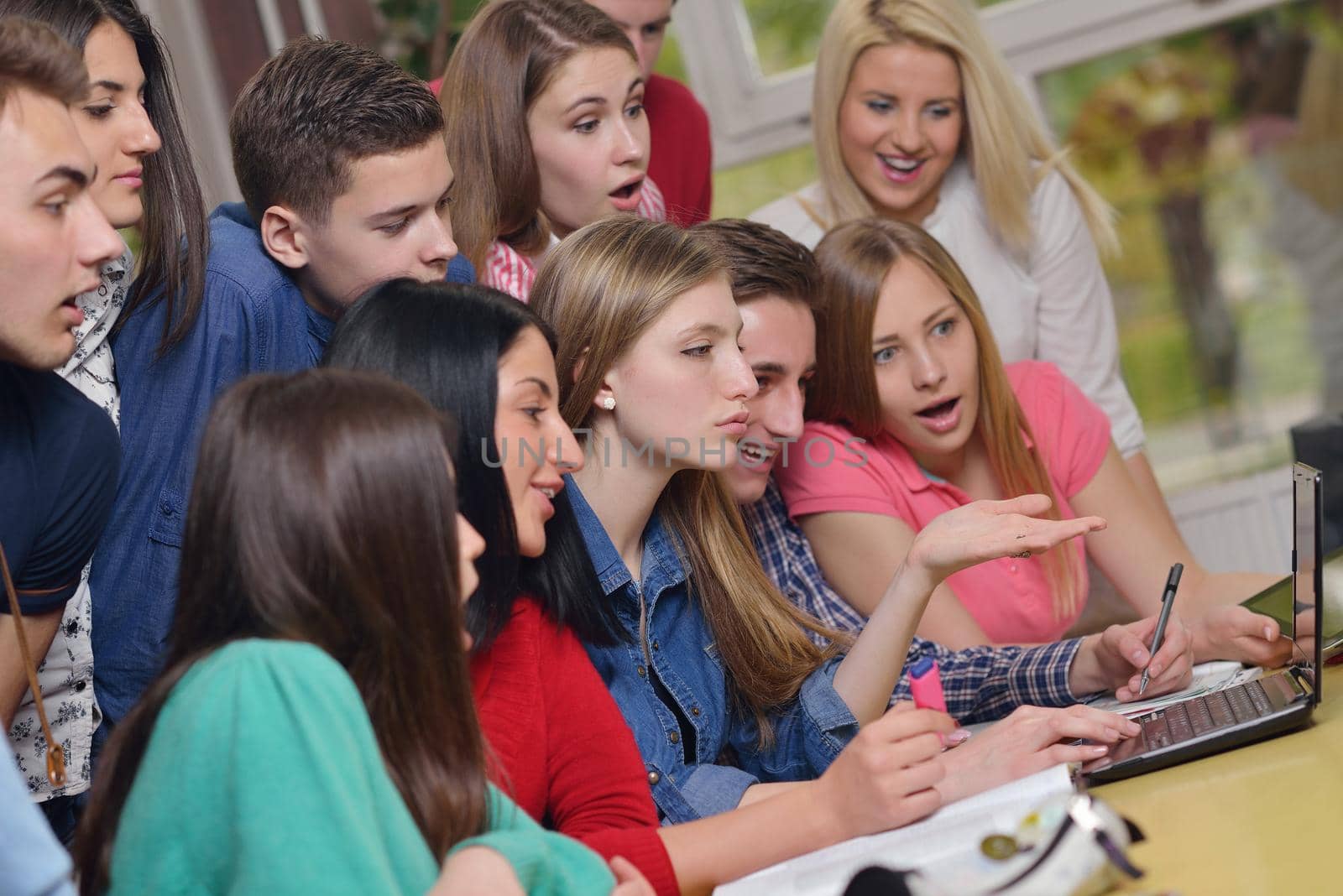 happy teens group in school by dotshock