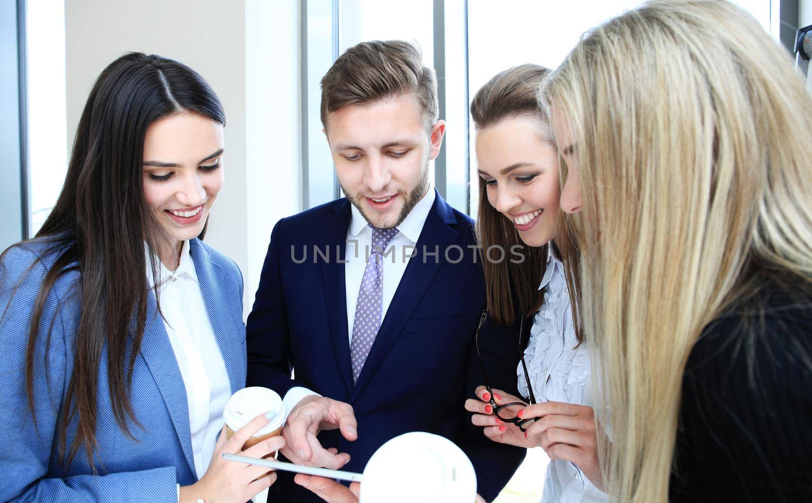 Group of buisness people working on tablet