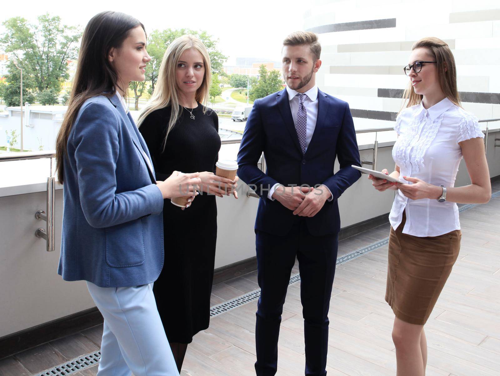 Portrait Of Business Team Outside Office by tsyhun