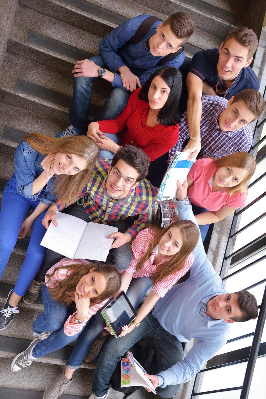 happy teens group in school by dotshock