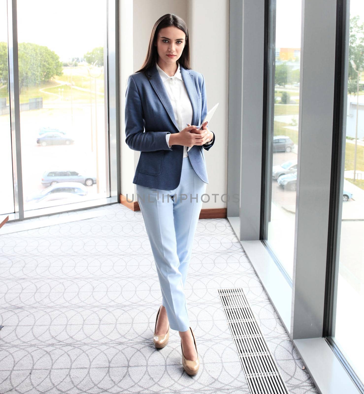 modern attractive young businesswoman full length portrait