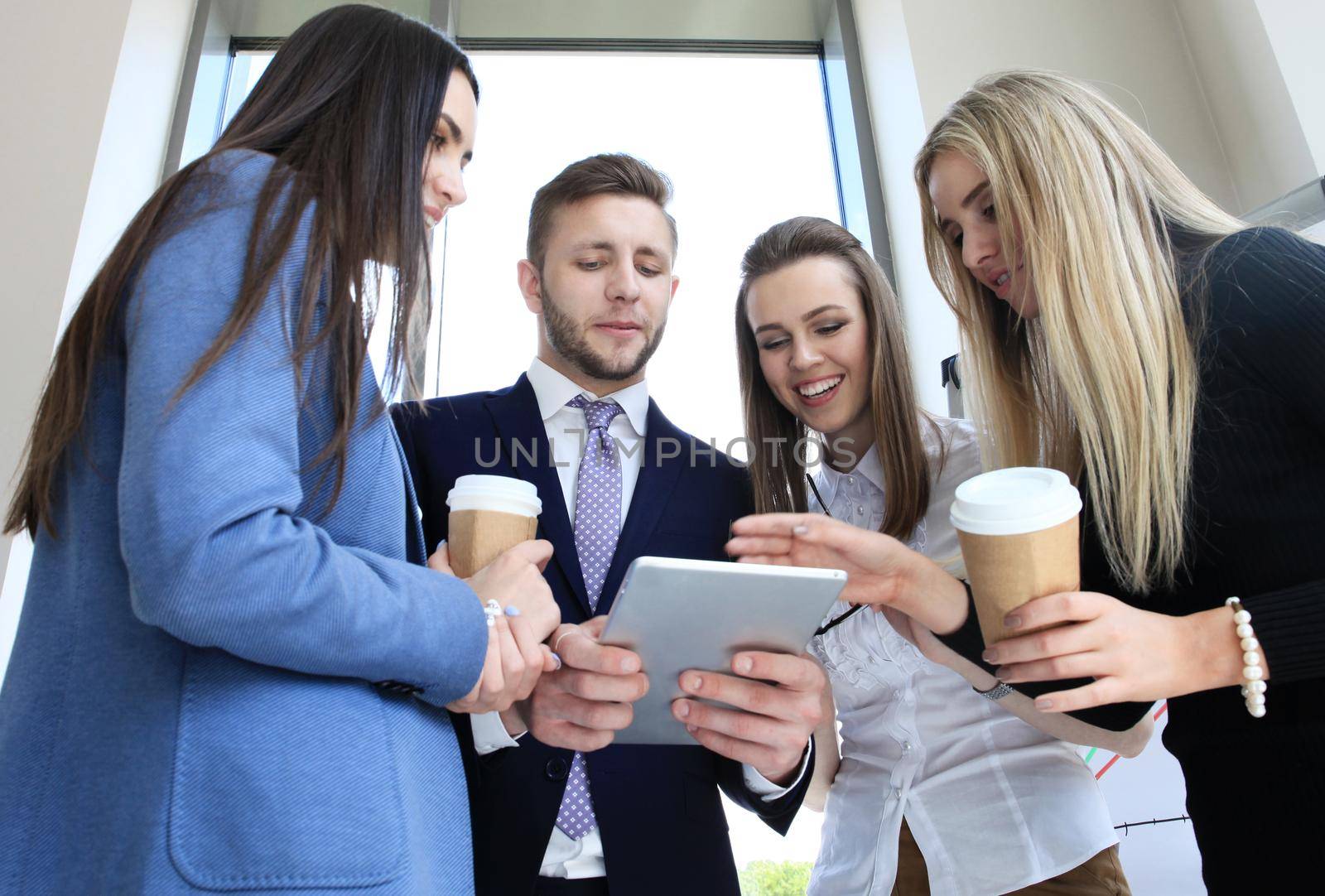 Group of buisness people working on tablet