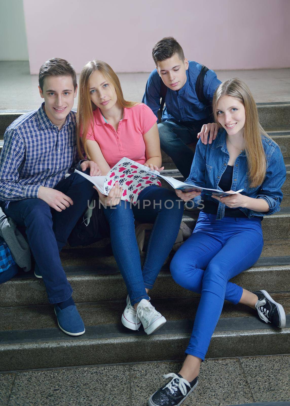 happy teens group in school by dotshock