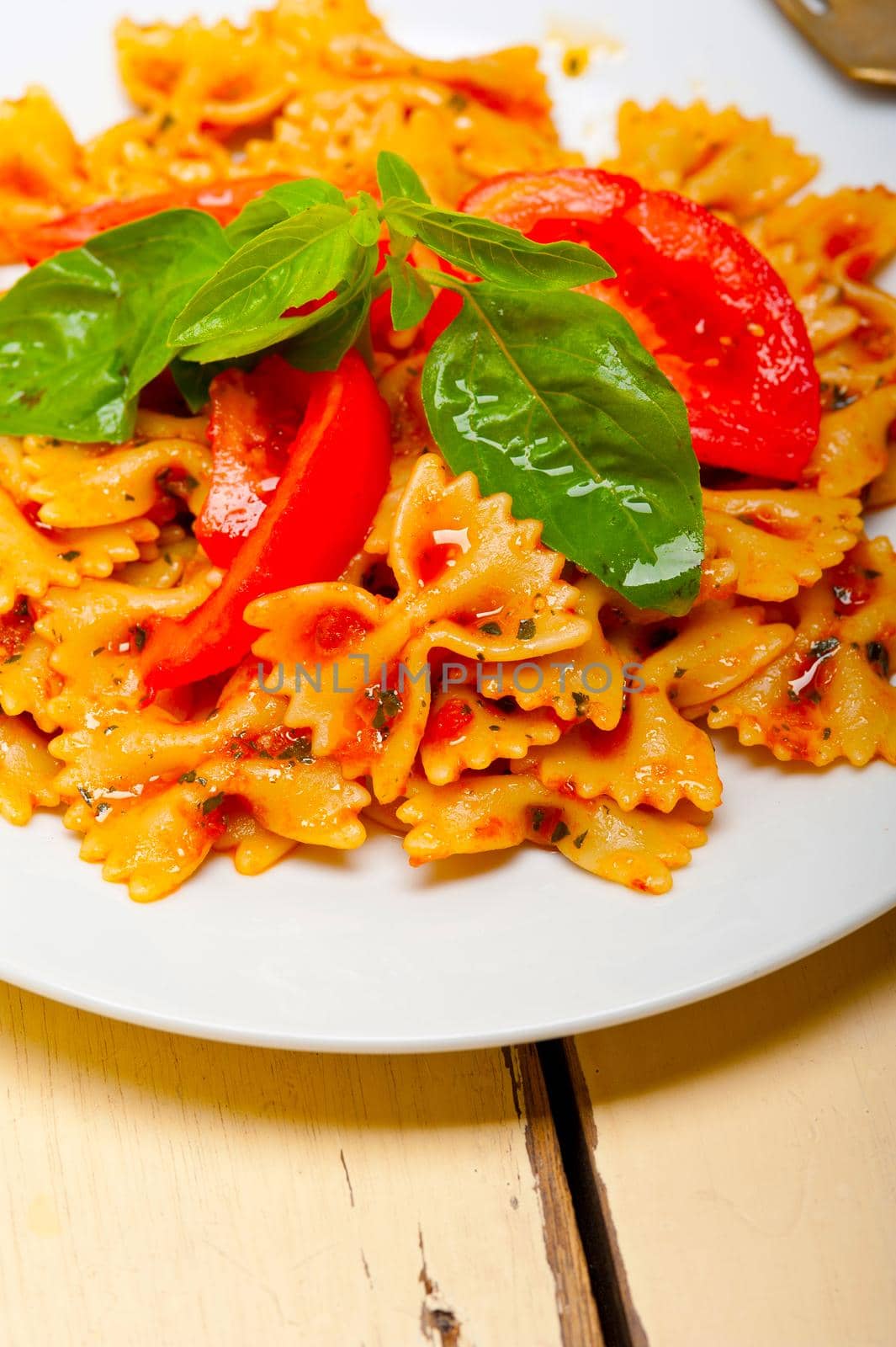 Italian pasta farfalle butterfly bow-tie and tomato sauce by keko64