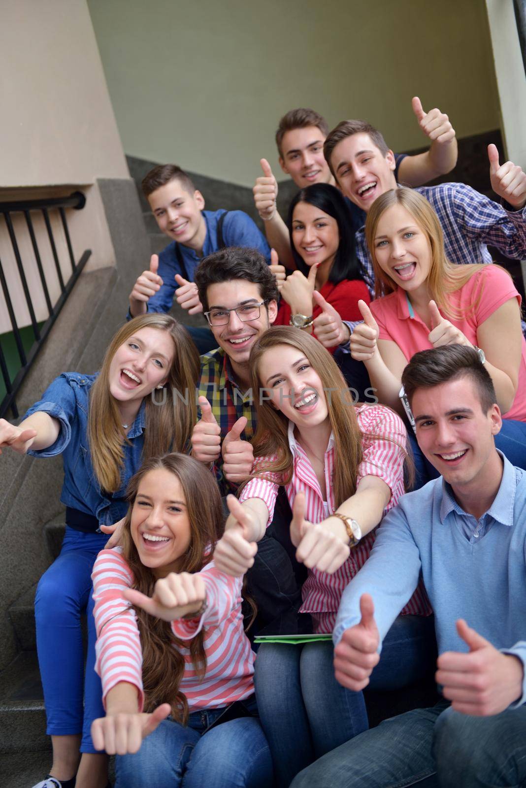 happy teens group in school by dotshock