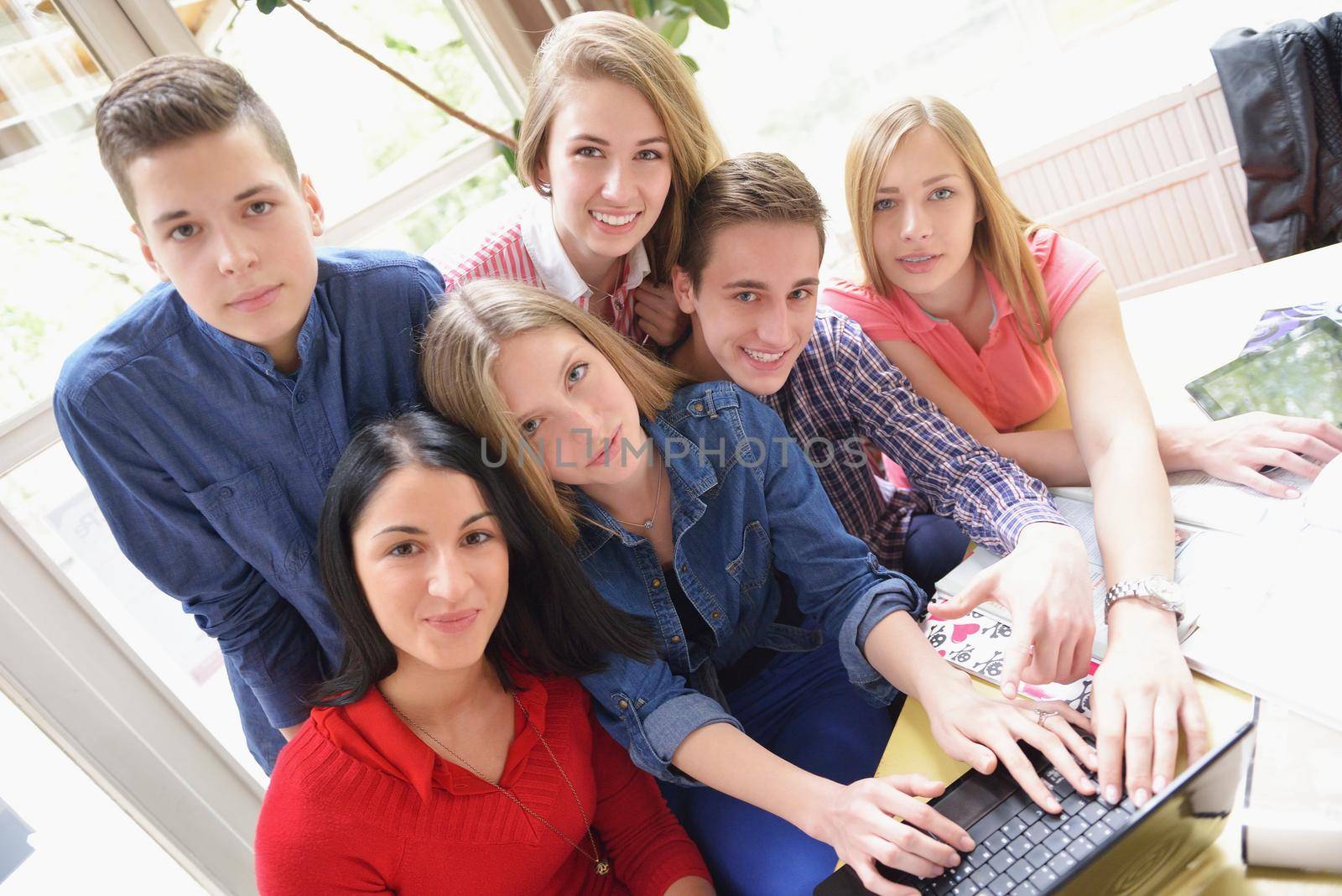 happy teens group in school by dotshock